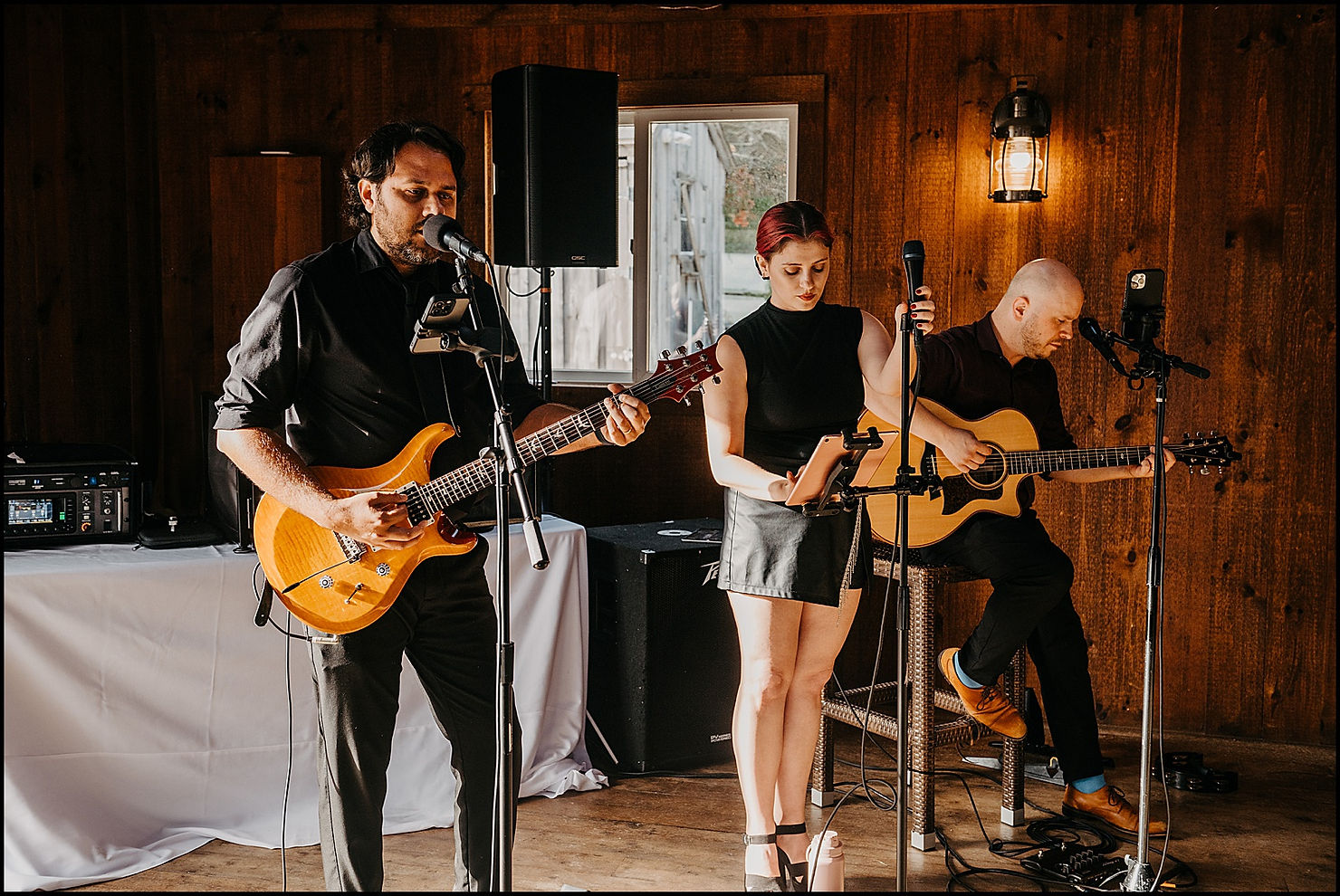 A wedding band plays on a low stage.