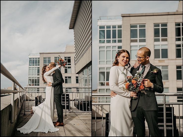 A bride and groom pose for a portrait on a balcony at their New York City wedding venue.