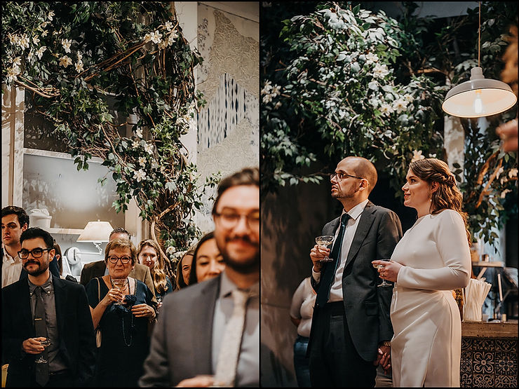 A bride and groom hold hands smiling in the reception space at a New York City wedding venue.